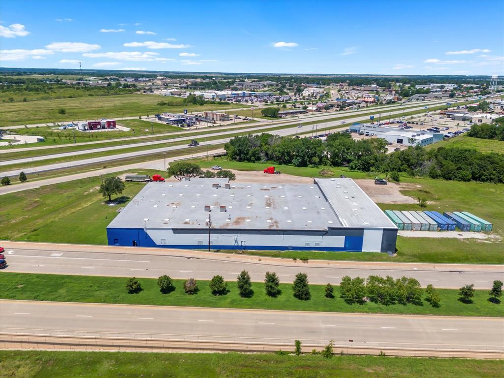 It's all about the location and this property has it. This 43,020 sq ft warehouse along with 8+ acres is located on the corner of 175 in Kaufman just minutes away from either HWY 20, HWY 30 and HWY 635 which can get you into the Dallas metroplex in under an hour. This newly painted warehouse has upgraded electrical panels and a new roof within the past year. The warehouse is ready for your business to move right in with 3 full size bay doors
2 manual and 1 motor chain as well as a dock plate for easy deliveries. The large 8+ acre lot makes it easy for semi trucks to deliver and park if needed the city has this parcel zoned Real Industrial (NEC). Come be a part of Kaufman County which has been named by the US Census Bureau as the fastest-growing county over 100,000 in the nation.