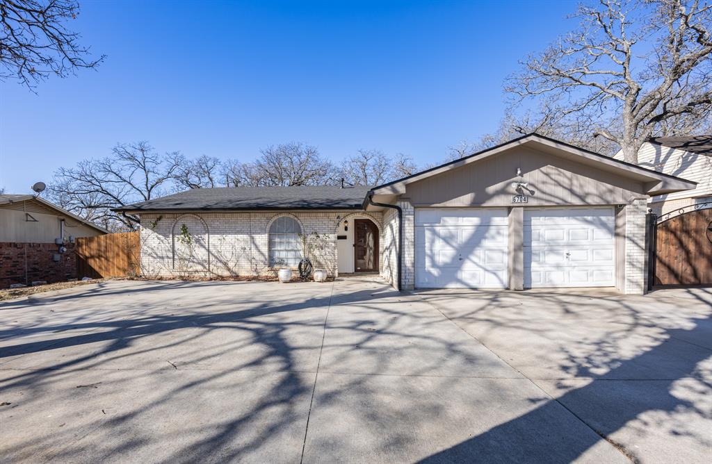 Welcome to this charming home ready for move-in! This inviting 3-bedroom, 2-bath property offers a traditional floor plan with neutral tones. The kitchen features granite countertops with appliances included. Enjoy the warm natural light flowing through the spacious living and dining areas with fresh paint. Enjoy family time outside with a large fenced backyard with plenty of room for outdoor gatherings or pets to play with, and a covered patio to enjoy even on those rainy days. This home also features an attached garage and an expanded driveway with additional parking to the rear of the home. This home is conveniently located just minutes away from major highways, schools, parks, shopping, dining, and so much more.