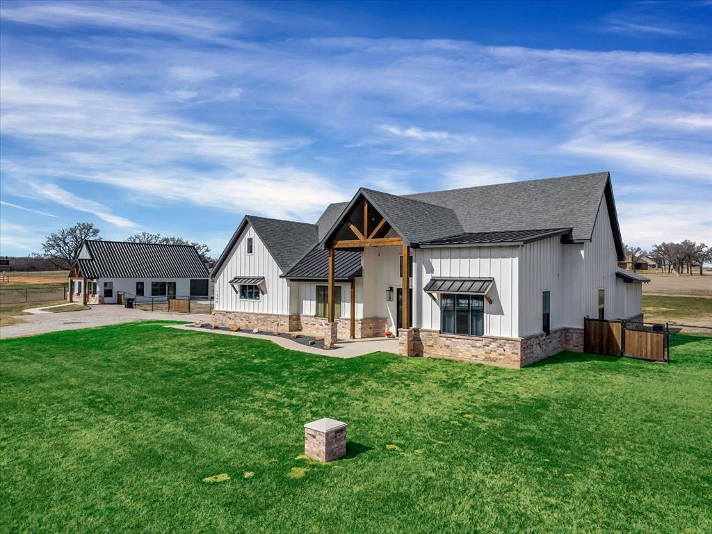 VA Assumable-Motivated Sellers! Set on four acres, this custom-built 2021 property offers approximately 3,806 square feet, with seven bedrooms and four and a half bathrooms across the main residence and guest house. Set in Poolville within Parker County, the property offers a more private, expansive way of living while still providing seamless access to Weatherford and Fort Worth for dining, shopping, and everyday ease. Located 5 minutes from Poolville schools and 12 minutes from Peaster schools.
The main residence spans approximately 2,756 square feet, featuring five bedrooms and three full bathrooms. Designed with both comfort and functionality in mind, the home offers open living spaces, cathedral ceilings, and large windows that bring in natural light and connect to the surrounding landscape. A stocked pond creates a peaceful focal point, while the fully fenced acreage offers space for outdoor living, recreation, or future expansion. Livestock welcome. With virtually no light and noise pollution the sky comes alive at night and makes for the perfect spot to unwind and enjoy the quiet sounds of nature. In 2023, a separate guest house was added, offering approximately 1,050 square feet with two bedrooms, one full and one half bathroom, along with an attached insulated workshop, ideal for extended family, guests, a private office, or potential income opportunities. Additional features include an attached two-car garage with generator hookup, providing both convenience and peace of mind. A rare opportunity to own newer construction with acreage, water features, flexible living space, and true dark sky nights all in one offering. Reach out to learn more or schedule your private showing.