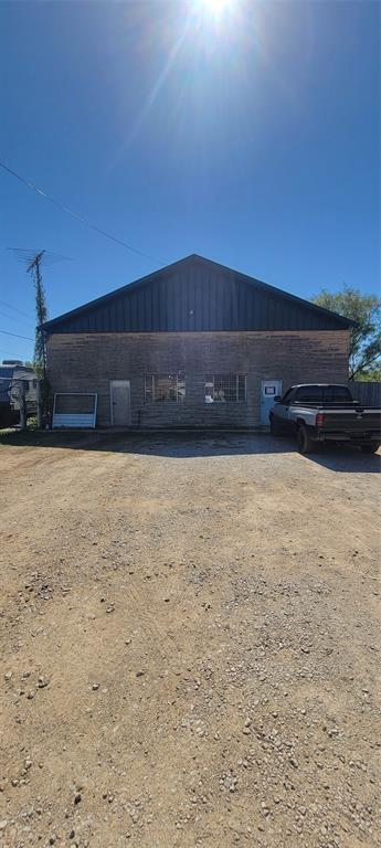 This is a great oppertunity to own a rent producing property or the shop youve always wanted. Some ammenities include large parking area outside fenced area. Large lot with multiple gates and 6ft. chain link pipe rail fence. Shop has two garage doors with a shop space of about 2000 s.f. Includes a rest room and office, reception area in the front. There is an additional 2000 s.f. covered parking connected to the shop. Property is currently occupied by a renter.