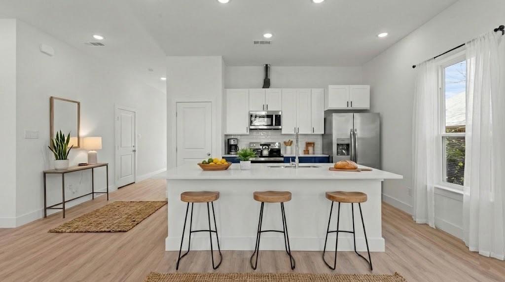 New construction home, with a builder warranty, is now complete! This thoughtfully designed one-level home offers 3 bedrooms, 2 baths, and a driveway and 2-car garage. Located in an established area with no HOA, this home features a covered front porch that leads into a modern front door. With approximately 1,377 square feet and an open layout with a bright kitchen showcasing a granite island, pantry, and seamless flow into the dining and living areas with 10’ ceilings.
Interior highlights include LVP flooring, granite bathroom vanities, and a spacious primary en suite with dual sinks, a walk-in shower, and a large closet. Set on a flat lot, the home combines quality construction with a convenient location near Historic Downtown Denison, Waterloo Lake Park, and Forest Park, with quick access to Highway 75 and Lake Texoma.  This home builder offers a 1 year limited construction warranty for the buyers peace of mind.