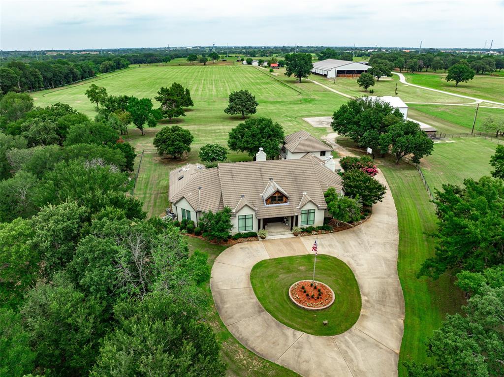 Rare opportunity to own 16 ac with beautiful custom home, office-guesthouse, helicopter hanger with pad, and pond in Town of Cross Roads. Contemporary design with landscaped backyard heated pool and spa, workout room, playroom, and two offices off second floor balcony with panoramic views. Separate 1,566 sf office-guesthouse nestled in grove tall oak trees. Mustang UD for residence water, area for grazing horses and 1,000' deep well and pond. Separate l,566sf office guesthouse not included in the 5,639 sf for main house. Additional 60 acres of land and equestrian improvements available for sale. Contact Broker for more information.