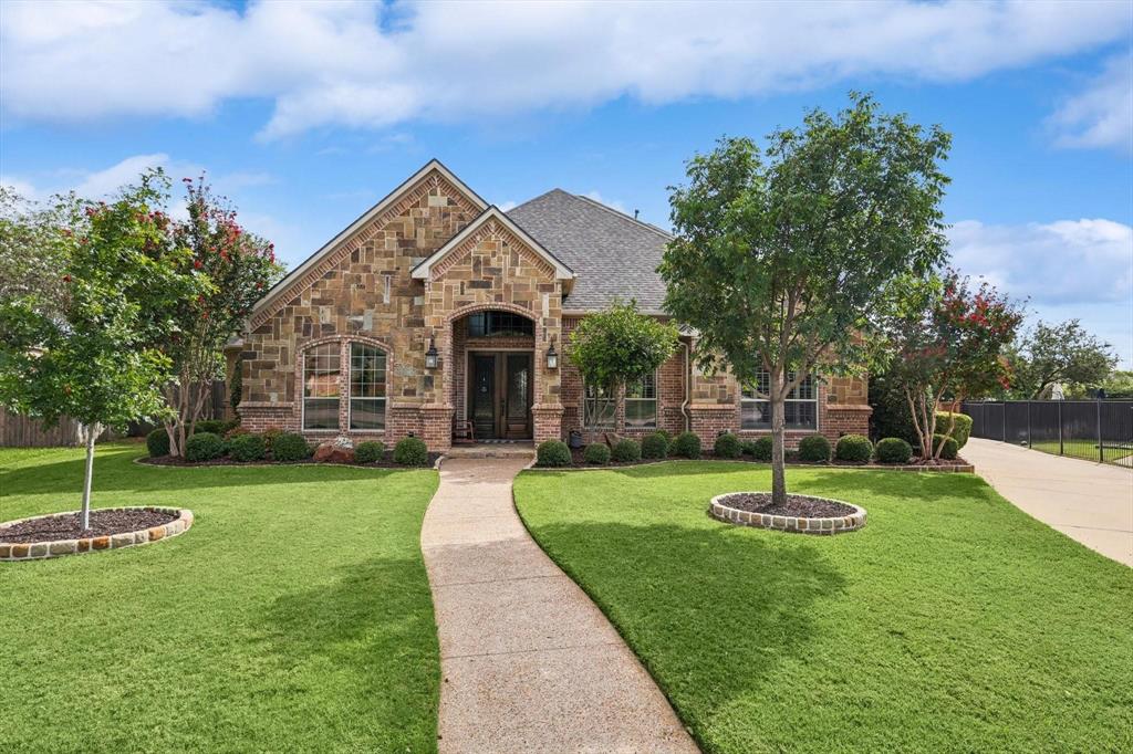 BACK ON MARKT. Beautiful , rare custom home in Reatta Place in Colleyville with fantastic curb appeal and a wonderful floorplan that features 4 bedrooms and 4 baths. 3 of them on first floor .  Executive study features built-ins and is perfect for working from home. Chefs kitchen was updated in 2020 with double ovens, new cooktop, microwave, dishwasher, and water softener. Enjoy movie night in your home theater with large screen, surround sound projector and reclining seats. Massive Game Room with wet bar. Inviting outdoor space includes saltwater pool, spa, water slide and water feature. Entertain outdoors in the gazebo, bar and cooking area as well as plenty of room for a dining table.2 storage sheds that are hidden behind hedges offer ample room for extra storage. RV hookup with 50 amp. Recent improvements: Roof & gutters July 2024, generator backup panel, water heaters 2016, 2 new AC units 2019, 3rd unit 8-24, new paint 2021, new carpet 2020 & 2021, backsplash 2021, pool pump and heater 2021,2024, new hardware 2021, some lighting replaced 2021, outdoor area-new tile 2021.