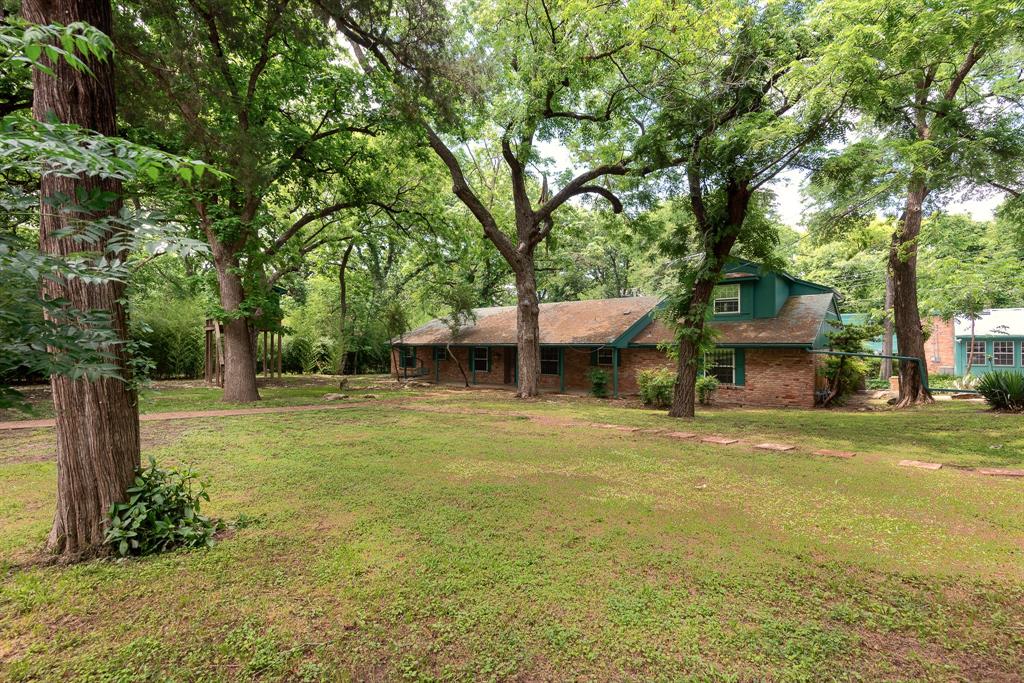 DUNCANVILLE ISD!!!!  Separate Apartment for multi-generational or income opportunity — a truly distinctive property on over half an acre of beautifully treed land offering exceptional space, versatility, and storage throughout.  
TOO MUCH TO LIST ALL THIS HOME HAS TO OFFER....
The property includes a 3,905 sq ft main residence plus a separate 1,240 sq ft, three-level apartment provides flexible space for guests, office, studio, or potential income use.

The main home features 4 bedrooms and 4.5 baths with extensive built-ins in nearly every room. The oversized kitchen provides abundant cabinet and countertop space, room for a breakfast table, and a separate formal dining area. The spacious main living area showcases a wood-burning stove and custom shelving. Additional spaces include a private office with built-ins, a flex room with shelving, and a game room featuring built-in shelves, built-in desk, window seat with storage, and a half bath. Main house also has a back up generator.  

The primary suite offers built-ins, dual sinks, oversized jetted tub, large shower, and an extra-large closet with safe room plus an additional closet. The primary bath connects to an additional handicap-accessible bath also accessible from a secondary bedroom. Upstairs includes a large bedroom with full bath and generous closet.

Outdoor amenities include a screened-in porch, large multi-level deck with gazebo, treehouse with electricity, two underground steel bunkers (vented and solar serviced) each with kitchen and bathroom, and three storage buildings

A rare opportunity offering character, functionality, and unmatched storage. Truly a must-see property.