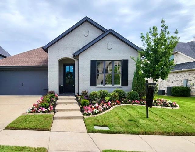 This beautifully maintained 4-year-new David Weekley home showcases timeless white brick with gray accents and exceptional curb appeal enhanced by mature trees, lush landscaping, and colorful flowers. From the moment you step inside, pride of ownership is evident. The welcoming entry features upgraded designer lighting and a glass front door that fills the space with natural light
Designed with both style and functionality in mind, this open-concept floor plan offers seamless flow throughout with warm wood-look luxury vinyl plank flooring and absolutely no carpet. A private study with double doors sits off the entry and can easily function as a second living area, home office, or flex space. Ceiling fans are featured in all rooms for added comfort.
The kitchen is truly the heart of the home, offering designer touches including light-stained cabinetry, white countertops, upgraded fixtures, a large walk-in pantry, and gas hookup capability. The kitchen opens effortlessly to both the dining and living areas, creating the perfect space for entertaining and everyday living. Expansive windows wrap the home in natural light, while the family room is anchored by a cozy fireplace.
The thoughtfully designed split-bedroom layout includes two secondary bedrooms and a well-appointed guest bath. The private primary suite overlooks the peaceful backyard and features an elegant ensuite bath complete with a separate black-framed shower, garden soaking tub beneath a picture window, dual sinks, and an extended vanity.
Step outside to enjoy the oversized covered patio with plenty of room for outdoor dining, relaxing, and entertaining. The backyard also includes two mature trees, adding shade and charm.
Residents enjoy access to outstanding neighborhood amenities including a clubhouse, community pool, gardens, and scenic walking trails.