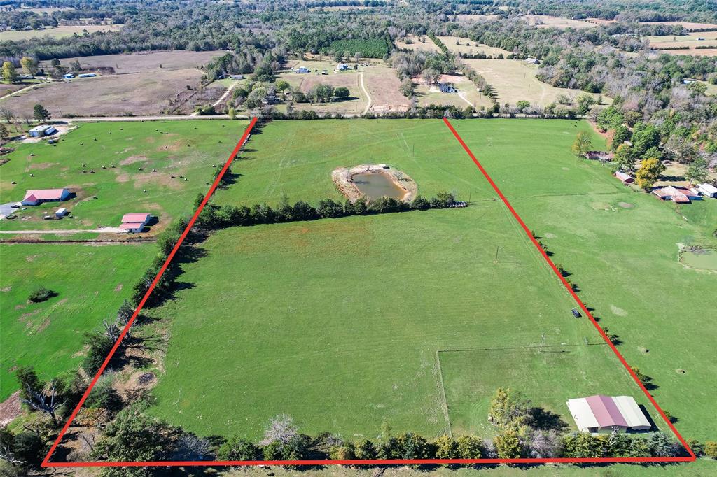 Discover 20.5 acres of prime countryside—endless possibilities on a private, picturesque parcel. This property features a comfortable barndominium with 3 roomy bedrooms and 1 bath, but the real draw is the land: rolling fields ideal for hay production, open space for livestock or hobby farming, and multiple sites ready for a garden, orchard, or additional outbuildings. A stocked fish pond provides a tranquil focal point and great recreational fishing, while two large carports (one an RV carport with hookups) support outdoor gear and seasonal travel. Enjoy wide-open views, privacy, and room to expand—perfect for outdoor enthusiasts, small-scale farmers, or anyone seeking a true country lifestyle. 
Fridge will stay with the home!