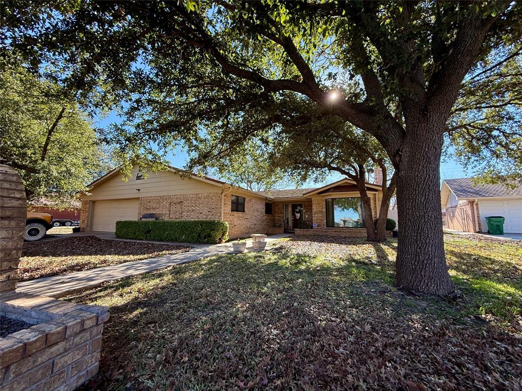 1401 W. Hill Lane  Coleman, TX 76834

Spacious and well-appointed, this four-bedroom, three-bath home sits in one of Coleman’s most desirable neighborhoods—up on the hill—and offers comfort, functionality, and excellent curb appeal.

The heart of the home is the newly updated kitchen, featuring granite countertops, laminate flooring, a black and stainless gas stove, dual stainless sink, abundant cabinetry with built-ins, matching black dishwasher, refrigerator, and trash compactor, plus a stainless built-in microwave. An eat-in bar provides additional seating and makes the space ideal for gathering and entertaining. Seller to give an $8000 carpet allowance with acceptable offer

The kitchen flows seamlessly into the open-concept living and dining areas, highlighted by a large brick fireplace and oversized windows that overlook the beautiful backyard and allow for abundant natural light. Just off the living room is a dedicated entertainment area, perfect for musical instruments, a sitting space, or hobbies, enhanced by a large picture window.

This home offers a split-bedroom arrangement for added privacy. The primary suite includes an attached office area and private bath. A second wing features two bedrooms and a full bath, while the third wing offers a large bedroom with a walk-in closet, a craft room or workshop with direct access to the backyard, and a spacious bathroom with a jetted garden tub, walk-in shower, and linen storage.

Additional features include a full-size laundry room and an oversized garage with built-in shelving on both sides.

Outside, the property is beautifully maintained with a screened-in porch, landscaped and fully fenced backyard, storage building, and mature pecan trees. The front of the home boasts outstanding curb appeal with large oak trees, sidewalks leading to the street, mailbox, and driveway.

A wonderful home in a quiet, established neighborhood—this property offers space, versatility, and charm both inside and out.