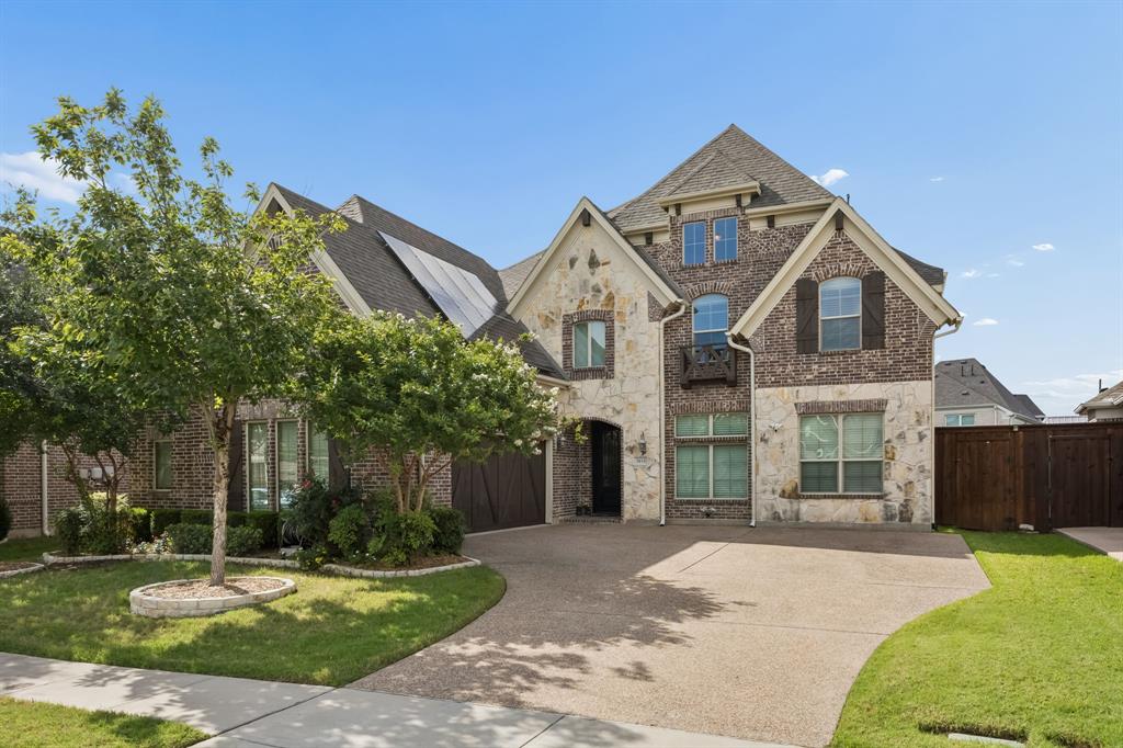 Exceptional 5-bedroom home in the highly sought-after Tribute, offering 4,236 sf of beautifully designed living space. Built in 2016, this spacious home makes a memorable first impression with a grand entrance and elegant spiral staircase. The main level features a large open living room and kitchen with 5 burner gas stove, double ovens with convection option, whole house water softener, and reverse osmosis faucet. Finishing out the first floor, you will enjoy a formal dining room, two first-floor bedrooms, laundry room plumbed for a sink, and a huge media room with 160 in projector screen, receiver, and surround sound speakers perfect for entertaining or relaxing at home. A swing driveway provides abundant parking in addition to the two-car garage with 5 feet of extra storage space. Upstairs, you’ll find three additional bedrooms, two game rooms, and another oversized living room for a second media or playroom, creating incredible flexibility for work, play, guests, and everyday living. The large grassy backyard offers plenty of room to enjoy the outdoors, along with a side garden for added charm and a gas stub for your future grill. Life in The Tribute is truly special, with resort-style amenities including two community pools, one within walking distance, parks, playgrounds, pickleball courts, a children’s splash pad, and miles of hike and bike trails along Lake Lewisville and the nature preserve. The community is also home to elementary and middle schools, The Tribute Golf Club, and a brand-new marina this summer. Residents enjoy year round signature events, including the annual Independence Day festival with an incredible fireworks display and golf cart parade. Recognized as Community of the Year multiple years in a row, The Tribute offers an unmatched lifestyle in a premier location just minutes from The Star, Legacy West, PGA Headquarters, and so much more. Solar panels paid off at closing and tankless water heater for added energy efficiency all year long!