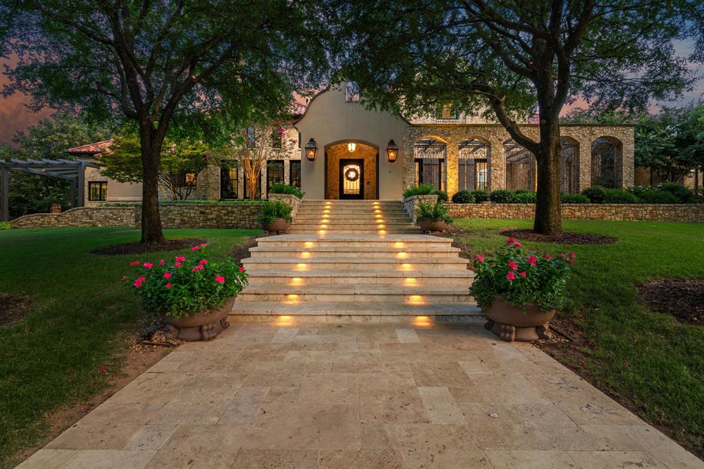 Santa Barbara-inspired estate in Vaquero, privately tucked on a cul-de-sac within the coveted guarded and gated community. This 4 bedroom, 4 full and 3 half bath home features a 4-car garage with expanded driveway for additional parking. The gourmet kitchen is equipped with Thermador appliances, quartzite countertops, custom cabinetry and reclaimed warm beams, complemented by all-new Pella windows and doors and designer light fixtures throughout. The luxurious primary suite offers a sitting area with fireplace, while the spa-like bath is finished with Cremo Delicato marble countertops, Calacatta Gold marble floors and a zero-transition oversized shower. Upstairs you’ll find two bedrooms, a spacious game room and media room, perfect for entertaining and family fun. The outdoor oasis includes a NEW sparkling Claffey pool and spa, fire pit, pergola with grilling station and lush landscaping. Premier location with access to Westlake Academy IB World School and the option for a Social Vaquero membership available separately.