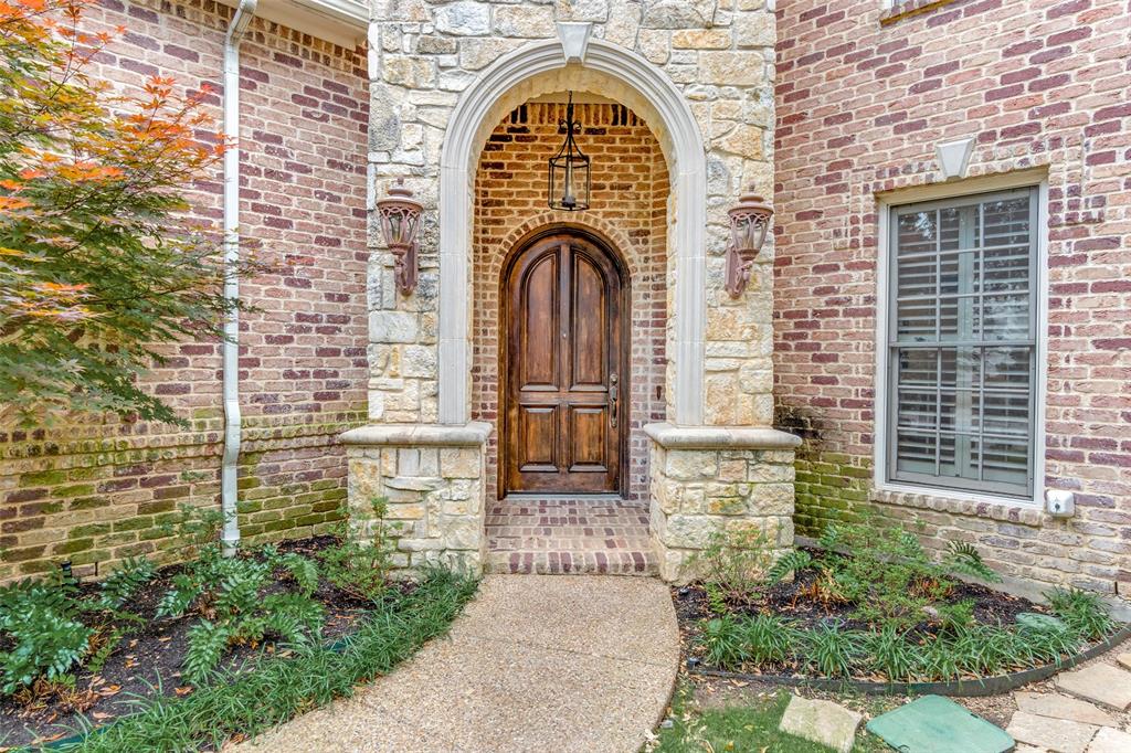 Welcome to this beautifully designed, custom-built traditional home in the sought-after, gated Cochran Hollow community. Located near the private school corridor and walkable to Central Market, this property features exceptionally low HOA fees, a NEW ROOF and NEW HOT WATER HEATER. Inside, new white oak floors and fresh paint create a bright, inviting atmosphere. The functional semi-open floor plan features a primary suite on the main level with an en-suite bath and a large walk-in closet. The upstairs houses three generous bedrooms, an open study with built-ins, and a versatile bonus room with extra storage. The kitchen features granite countertops, stainless steel appliances, a double oven, and a gas cooktop. Outdoors, a covered patio with a built-in fireplace overlooks a low-maintenance turfed yard and water feature. Enjoy privacy and peace of mind just minutes from local shopping, dining, Love Field airport, the Medical District, and Downtown.
