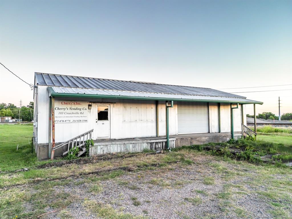 Positioned on Creechville Road in Ennis, just minutes from Buc-ee's, this 0.8-acre commercial site offers outstanding visibility and accessibility in one of the city’s most active growth corridors. The triangular configuration runs alongside the railroad, creating a natural boundary while allowing for functional outdoor storage or yard use. With frontage on Creechville Road, the property benefits from steady traffic flow and strong exposure.

The existing structure is a metal building elevated with dock-high access, designed for practical utility. Inside, the layout offers a combination of office and warehouse space, making it adaptable for contractors, service providers, mechanical or tech users. With renovation, the space could also transition to personal services such as salon, wellness, therapy, or specialty retail.

At $349,000, opportunities with commercial frontage at this price point are increasingly rare in Ennis. Establish a strategic foothold near one of the area’s strongest traffic corridors. This site warrants serious consideration. Contact listing agent for tour. 

Ask agent also about potential leasing of the space.