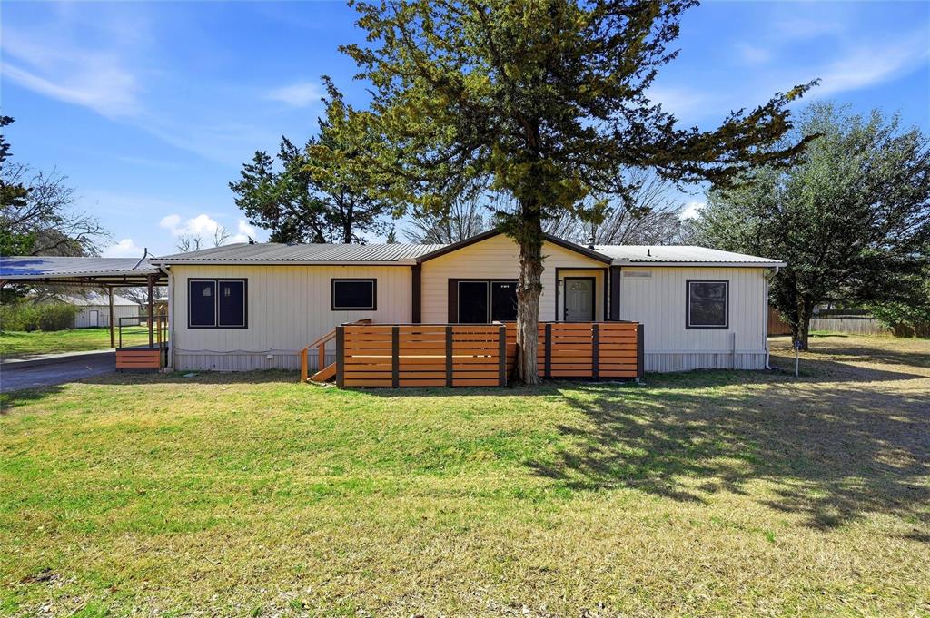 Motivated Sellers!! Recently updated and well maintained, this charming 3-bedroom, 2-bath home is located less than five minutes from Lake Texoma in the quiet community of Gordonville. Nestled on four spacious, wooded lots the property offers privacy, functionality, and plenty of room to enjoy the outdoors.  The exterior features an attached covered 30 x 30 parking structure, a 16 x 14 “she shed” or hobby space, and a 14 x 10 workshop complete with electricity, air conditioning and an attached covered dog pen—perfect for projects, storage, or extra workspace.  Inside, you’re welcomed by an open-concept floorplan with plenty of natural light.  The updated kitchen is equipped with granite countertops, plenty of cabinets and flows seamlessly into the dining area--creating an inviting space for gathering and entertaining. The split-bedroom layout offers privacy and comfort. The primary suite includes a spacious walk-in closet and private ensuite bath, while two additional bedrooms and a full bath are located on the opposite side of the home.  Enjoy peaceful mornings on the oversized front porch or relax under the large, covered area just off the kitchen. With ample parking space for vehicles and easy access to Hwy 377, convenience meets tranquility in this move-in-ready property.  Make the trip to see this one--Welcome Home to 76 Forest Lane!