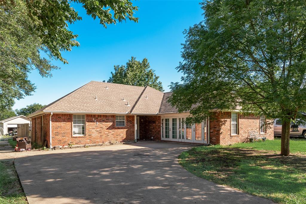 Great opportunity to own this  5-bedroom home on approximately .60 acres with NO HOA and located on a quiet cul-de-sac! This home offers over 2,000 square feet of living space and plenty of room for everyone. The large eat-in kitchen features abundant counter space, ample storage, and a smooth-top range, making meal preparation a breeze. The inviting living area is highlighted by a cozy fireplace, perfect for relaxing evenings at home. The primary suite features a recessed ceiling and provides a comfortable retreat at the end of the day. Step outside and enjoy your own private backyard oasis complete with a beautiful inground gunite pool and hot tub, ideal for entertaining family and friends all summer long. Need extra space for projects, hobbies, or storage? The detached 2-car workshop includes electricity and offers endless possibilities. New Hot Water Heater July 2026. Also, Seller has done a lot of clean up since the photos were taken. Enjoy the freedom of country-style living with the convenience of nearby shopping, dining, and schools. Don't miss this unique property! To be sold as is. Cash or conventional financing only.