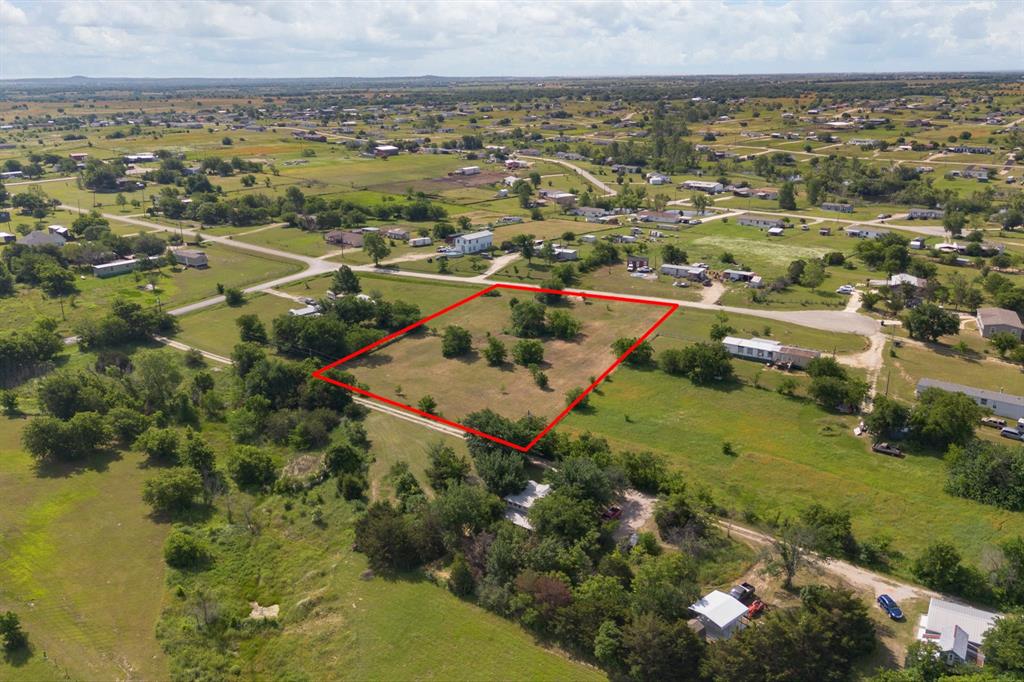 Discover the perfect setting for your dream home on this beautifully cleared 1.5-acre property. Nestled along a quiet paved road, this serene slice of countryside offers breathtaking sunrise and sunset views that make every day feel special. With minimal restrictions, you’ll enjoy the freedom to design and build the home that truly fits your vision. The property also features convenient access to a water meter and electric service, making your building process even easier. Ideally located with quick access to Chisholm Trail Parkway, you’re just minutes from Fort Worth—close enough for everyday conveniences, yet far enough to enjoy the peace and quiet of country living. Come experience the tranquility, space, and endless possibilities this property has to offer.