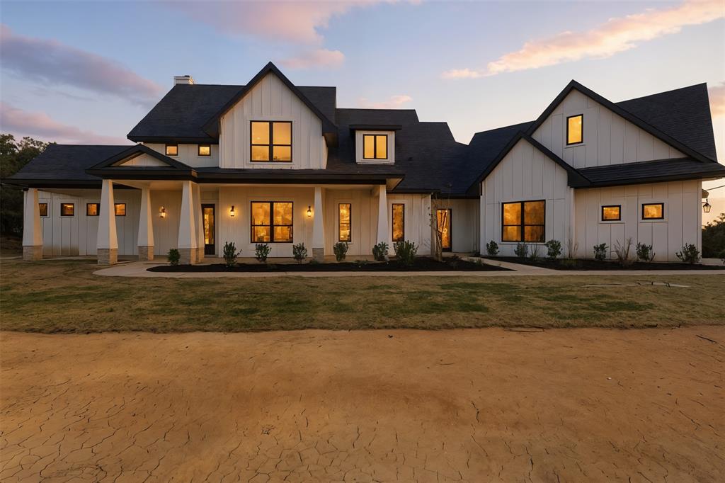 Stunning New Construction with Lake Views in Sunset, Texas

Discover modern country living at its finest in this breathtaking new construction home nestled on a spacious lot just minutes from Amon G. Carter Lake. This contemporary farmhouse blends elegant design, luxury finishes, and peaceful surroundings for the perfect Texas retreat.

Step inside to find an open-concept layout with soaring ceilings, large picture windows, and an abundance of natural light. The gourmet kitchen features custom cabinetry, quartz countertops, stainless steel appliances, and a generous island that’s perfect for entertaining. The living room boasts a cozy fireplace and flows seamlessly into the dining area and outdoor spaces.

Enjoy evenings on the covered patio taking in scenic views of the surrounding trees and nearby lake. With its combination of refined style, thoughtful craftsmanship, and peaceful rural setting, this home delivers the best of both luxury and tranquility.

Highlights:
Brand new construction (2025)
Open-concept floor plan with designer finishes
Gourmet kitchen with quartz countertops and high-end appliances
Spacious primary suite with spa-style bath
Covered patios and outdoor living spaces
Just minutes from Amon G. Carter Lake
Peaceful, private setting with easy access to Decatur and Fort Worth

Experience the perfect blend of modern living and country serenity — welcome home to Sunset, Texas.