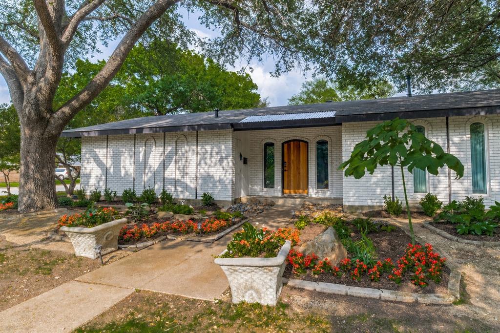 Large corner lot in Lakeland Hills with HVAC system installed in 2026. This beautifully updated 3-bedroom, 2-bath ranch sits on one of the larger lots in the neighborhood, with beautiful landscaping and a convenient side-entry two-car garage. A dedicated office has its own separate entrance through a charming courtyard—ideal for working from home, a studio, or guest space. Skylights bring in natural light.

Thoughtfully redesigned in 2021, the home blends modern upgrades with warm, inviting character.

At the heart of the home is a stunning, fully remodeled kitchen featuring a large island, soft-close cabinetry, beverage fridge, designer tile, and stylish finishes. The vaulted ceiling in the living room adds an open, airy feel, while two separate living areas offer flexibility for gatherings, relaxation, or creating distinct spaces to suit your lifestyle.

Step outside to enjoy the large backyard, complete with a covered patio added in 2023—perfect for outdoor dining or entertaining under the shade of mature trees. A privacy fence surrounds the yard.

Additional 2021 upgrades include a new roof and all new high-efficiency windows, offering comfort and energy savings for years to come.

This move-in-ready home offers thoughtful updates, flexible living spaces, and exceptional outdoor features in Lakeland Hills. Ideally located with easy access to I-635, this home offers a convenient commute while maintaining a peaceful neighborhood setting.