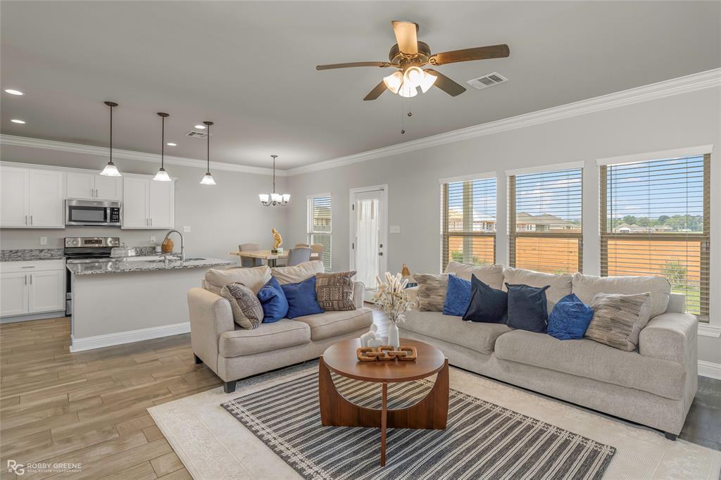 ONLY 3 YEARS OLD IN DESIRABLE HAUGHTON! Legacy Pointe is one of Haughton's fastest growing subdivisions in a convenient location and at great price point. 107 Vienne Trace offers 3 bedrooms, 2 bathrooms, 1514 square feet, and a 2-car garage. Step inside to find beautiful neutral colors and a welcoming foyer with a spacious coat closet. To the left you'll find two secondary bedrooms each with ample closet space and the second bathroom. As you enter the living area, you'll be greeted by an abundance of natural light and a flowing open concept layout ideal for simplified daily living or entertaining guests. The wood-look ceramic tile is low maintenance and can stand the test of pets and kiddos. The kitchen has stainless steel appliances, granite countertops, an electric range oven, pendant lighting, a pantry, and an island with room for bar stools. The primary suite has an ensuite bath with a walk-in closet and a large tub-shower combo. The back patio is covered and has plenty of room for rockers or your grill. Legacy Pointe provides easy access to I-20, Barksdale Air Force Base, North Bossier shopping and dining, Haughton conveniences, and excellent public schools. This home is ready for you to call it HOME!