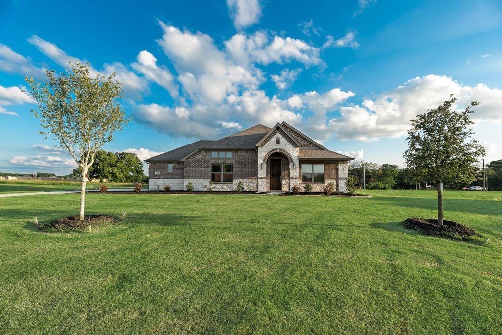 1-acre homesite with a 2,193 sq ft, 3 bed, 3 bath home. Features include an 8' front door, wood-look tile, stone-to-mantle fireplace, quartz countertops, built-in double ovens, wood vent hood, butler’s pantry, and an oversized 2-car garage. Functional layout with added flexibility from the third bath.