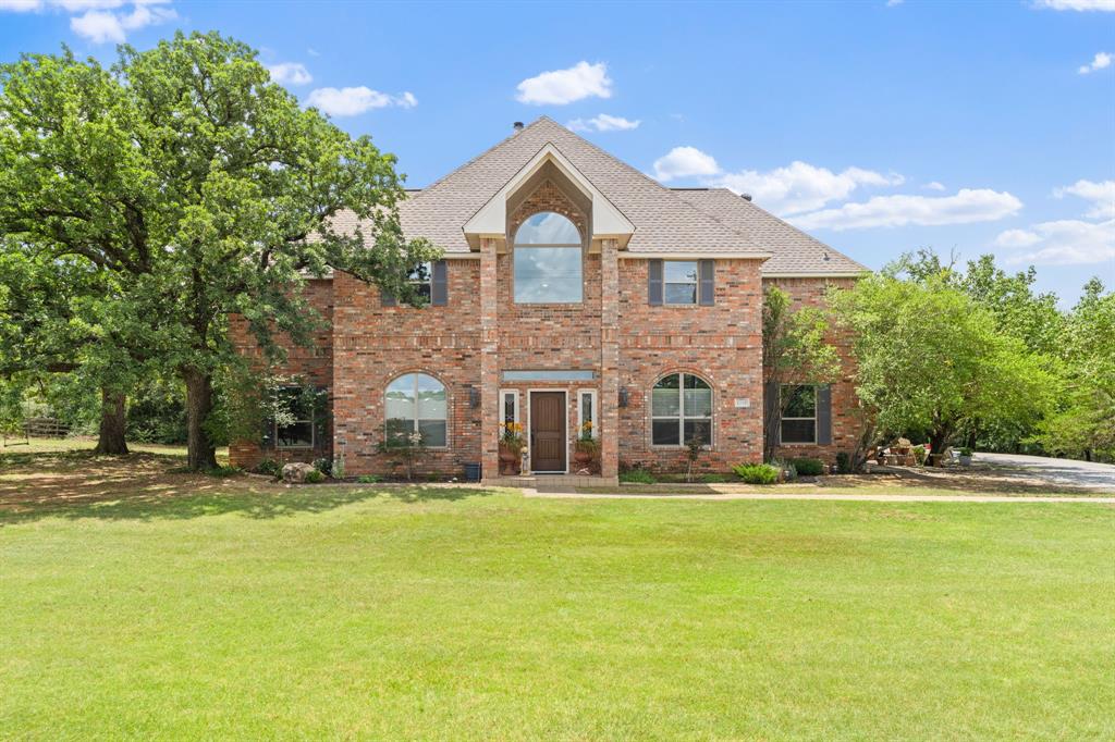 A world away.Private gated entrance and drive bring you to a timeless classic that offers every amenity of an executive estate.This well organized custom home gives a feeling of comfort and class.Perfect for a large family or multigenerational living , the large bedrooms with ensuite bathrooms create private spaces while the open floor plan makes the gathering center of the home perfect for entertaining.Massive closet and ample storgage create a place for everything, keeping each area streamlined. Master is downstairs as well as additional flex room with bath. Upstairs is 3 bedrooms,2 bathrooms and a entertainment room complete with wet bar.The backyard and pool offer a private fenced oasis to relax, entertain, cook,eat and enjoy the outdoors with family and friends.  
The winding walk and private drive from the home to the private barn that sits on the back of the property makes this place live so much larger than 6 acres.The effecient 6 stall horse barn complete with tack room, laundry, feed,tack rooms and wash rack, 4 paddocks for grazing nestled in the trees creating the illusion of the country.Your own private arena situated in a lovely treed setting gives you a place to ride on all weather footing. Carefully planned and positioned to maximize privacy and use of every inch of space ,while still maintaining distance of the barn from the house and a feeling of country right smack dab in the middle of it all.The property sits in the Medical corridor with several medical centers and three colleges are within 7 miles of the property as well. Thie home is a quick golf cart ride to Oakmont golf course and country club.  Las Colinas, Irving as well as Lake Shore polo clubs all in striking distance. Great proximity to Highland Village, Hickory Creek, Denton Square for all your dining and shopping needs. Lake Lewisville for boating and water sports is within 5 miles for those who enjoy water sports.Dallas and Fort Worth are an equal distance both approximately 30 miles.