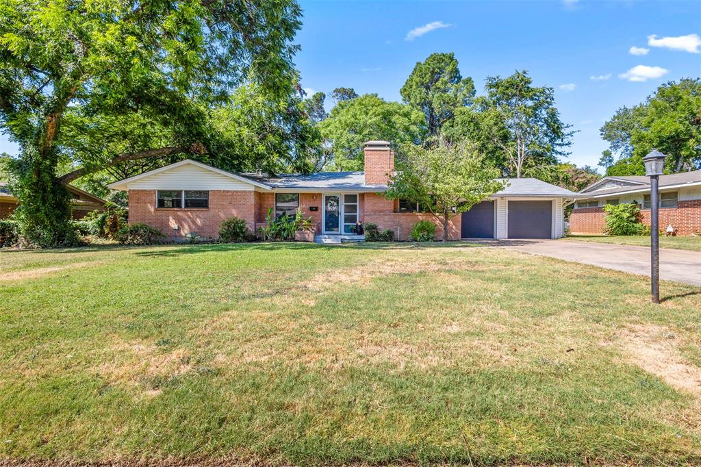Timeless charm meets modern comfort in this beautifully updated 4-bedroom, 2.5-bath Arlington home. Built in 1952, this property has been thoughtfully renovated while preserving the character and warmth that make it truly special, including the beautiful original hardwood floors. Inside, you'll find oversized bedrooms, two spacious living areas, and two dining spaces, offering plenty of room for everyday living and entertaining. The expansive sunroom overlooks a stunning backyard filled with mature trees and landscaping, creating a private retreat you'll enjoy year-round. Whether you're hosting family gatherings or simply relaxing at home, this property offers the perfect blend of classic charm, functional space, and peaceful outdoor living.