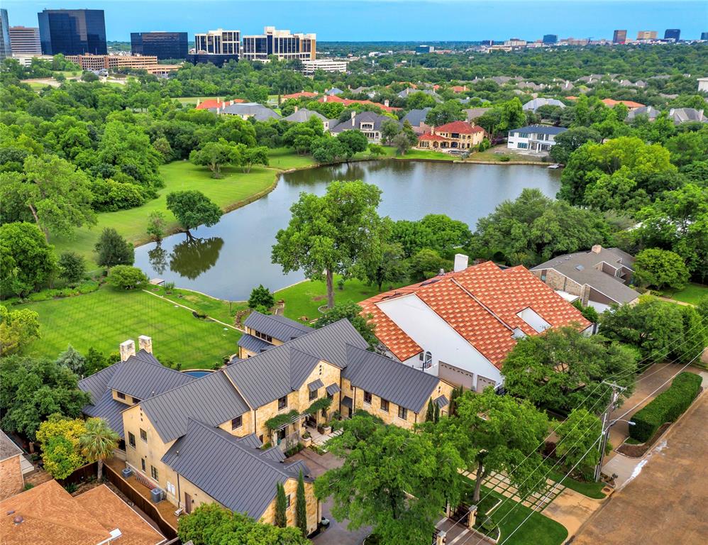 Welcome to your lake house retreat in this close-in Preston Hollow neighborhood with easy access to Dallas’s top rated private schools! Set on nearly an acre with mature landscaping by award-winning David Rolston and an infinity edge pool overlooking a private lake, this Hill Country home was custom built with exceptional materials and precise execution. This rare 6-bedroom ensuite layout designed by the talented Drew Womack also includes a private wing with separate staircase or elevator access for aging parents, an au pair or visiting family and friends. Modern amenities like whole house lighting automation, heated floors in both the downstairs primary and guest suites, an Alexa-integrated phenomenal surround sound system inside and outside, and an elevator that stops at every floor (even the attic) are merely some of the highlighted features! Just outside the 5-car motor court and front gates are pickleball and tennis courts offering this incredible amenity without paying the taxes!