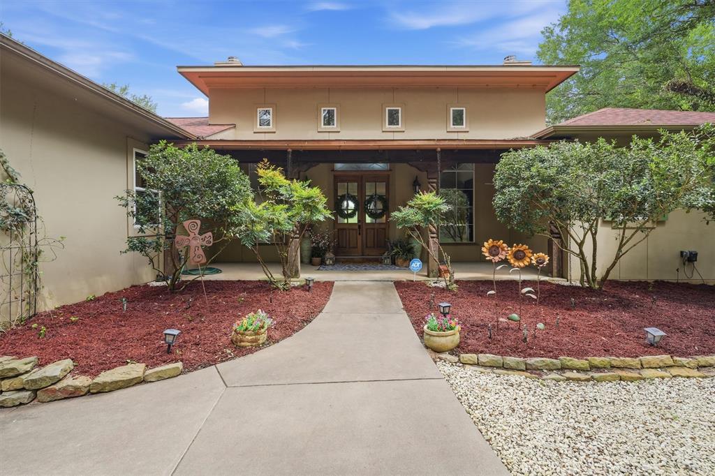 Rare Brazos Riverfront retreat with character, craftsmanship, and unmatched versatility. This completely updated property features two separate living areas, offering endless possibilities for entertaining, extended family, or guest accommodations. Rich history and custom details shine throughout, including reclaimed wood floors from 1800s Chicago building, impressive wood beams, a grand fireplace, custom cabinetry, granite countertops, and a Viking gas stove. The spacious primary suite is a true retreat with a stunning copper soaking tub. Additional features include surround sound, a convenient laundry closet with a built-in drop-down ironing board, a large workshop area in the garage, a tornado shelter, a new roof, and a new HVAC system. Outside, enjoy tiered gardens with irrigation, exceptional privacy, and direct access to the Brazos River with approximately 13-15 feet of water depth. A one-of-a-kind waterfront property designed for both comfort and lifestyle