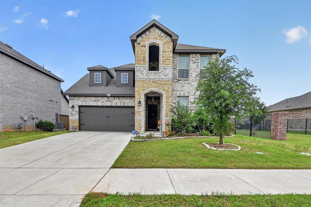 Stunning and spacious 4 bedroom, 3 bath Arlington home with an ideal layout and stylish finishes throughout! Step inside to soaring ceilings, beautiful wood-look tile flooring, and an open-concept design perfect for both everyday living and entertaining. The bright chef’s kitchen features an oversized quartz island, stainless steel appliances, gas cooktop, abundant cabinetry, designer lighting, and walk-in pantry, all opening seamlessly to the dining area and spacious living room filled with natural light.

The private downstairs primary suite offers a relaxing retreat with a spa-inspired bath complete with dual vanities, garden tub, separate oversized shower, and large walk-in closet. A dedicated office and secondary bedroom downstairs provide flexibility for guests or working from home. Upstairs features a huge game room along with additional spacious bedrooms and baths.

Enjoy outdoor living under the covered patio overlooking the large backyard with plenty of room to play or entertain. Located in a desirable community with easy access to shopping, dining, entertainment, and major highways, this beautifully maintained home truly has it all!