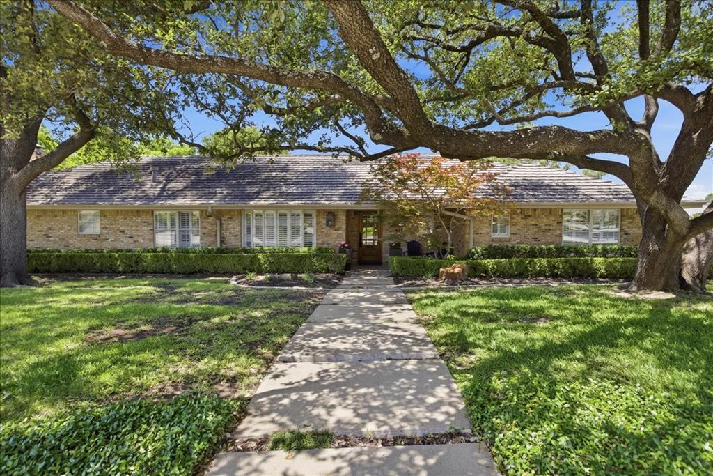 Set on an expansive corner lot and zoned to Overton Park Elementary School, this single-story ranch-style home offers a spacious and functional layout with over 3,600 sq ft. Designed for both everyday living and entertaining, the home features 4 bedrooms, 3 baths, and 3 separate living areas, with the split fourth bedroom and adjacent bath offering flexibility as a private guest suite, playroom, office, or additional flex space if needed. The updated kitchen opens seamlessly to the main living spaces, creating an easy, connected flow filled with natural light. A large center island, breakfast bar, and adjoining den with built-ins and a fireplace make the space feel both open and inviting. The sunroom with a wet bar adds another inviting space for entertaining or relaxing. The backyard offers two decks and a pool, creating inviting outdoor living spaces. Additional features include a gated drive and a two-car garage with an extra storage room that could easily function as a workout space. Ideally located near TCU, Colonial Country Club, Trinity Trails, and The Shops at Clearfork.