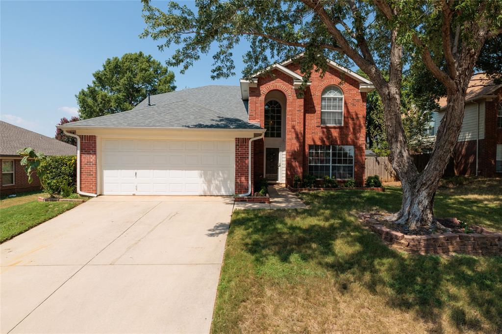 Just minutes from Lake Lewisville, this beautifully maintained 4-bedroom, 3-bath home sits in the sought-after Thousand Oaks community of Lake Dallas. From the moment you arrive, the pride of ownership is evident, this home shows like a model and has been taken care of diligently. Replaced roof, HVAC, flooring, and many more updates.

The open floor plan connects kitchen and living areas seamlessly, anchored by a living room fireplace and soaring ceilings that create an inviting, spacious feel. The kitchen is equipped with a kitchen island and ample cabinet space. The primary suite downstairs offers a peaceful escape with a soaking tub, separate shower, dual sinks, and a generous walk-in-closet. Upstairs you'll find a second primary suite plus two additional bedrooms. Step outside to your private backyard retreat featuring a patio, mature landscaping, and a sprinkler system to keep it all looking sharp.

A 2-car garage, wood-burning fireplace, and cul-de-sac lot round out a package that's hard to beat at this price point. Zoned to Lake Dallas ISD. Condition is immaculate. Offers reviewed as received.