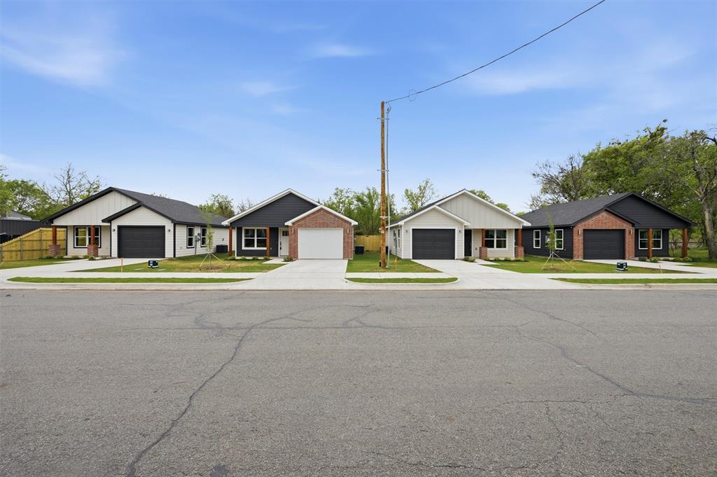 These three newly constructed homes offer an efficient and thoughtfully designed 946 square feet of living space (total of 2,838sf), each with two bedrooms and two full bathrooms. The interiors are finished with marble countertops, walk-in pantry, and kitchen equipped with an electric oven and stove, microwave, and a separate washer and dryer room (washer and dryer included). The primary suites include a walk-in closet, built in shelving and drawers, backlit mirrors and a spacious tiled walk-in shower. Each home also includes a one-car garage, fully enclosed privacy fenced yard, and covered front porch. These homes are located approximately one mile to downtown Sherman.
