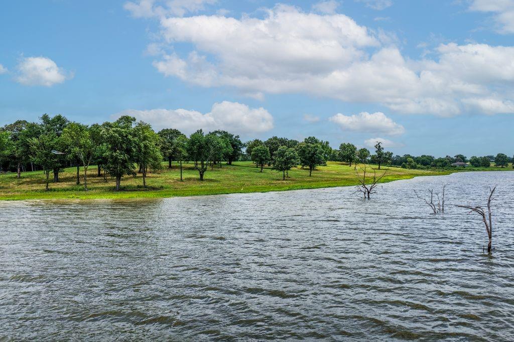 LAKE FORK WATERFRONT!! GORGEOUS SUNRISE & SUNSET VIEWS FROM THIS HILLTOP LOT WHERE 3 FORKS OF THE LAKE CONVERGE! ABSOLUTELY STUNNING WATER VIEWS!! Such a peaceful setting with good water year round!! Must See to Appreciate! Owner tote the note Available!