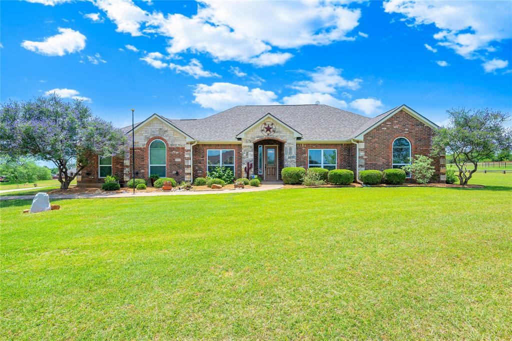 Brock ISD!!   Single story home on just over an acre with 20x30 shop!   Three bedroom home with option of formal dining room could be office or 4th bedroom.  Woodburning fireplace and ceiling fans throughout the home.   This home has been upgraded with granite countertops, fresh paint, new appliances,  new roof April 2026, gutters, landscaping, heat pump and more.   Amenities include an extra wide driveway, enlarged covered back patio and shop with electric, overhead rolling door and insulation with a covered overhang.   With some added fencing you can bring your horse!  Property is fenced along back side.   Easy access and commuting on I20 makes this property the perfect blend of country living and convenience.