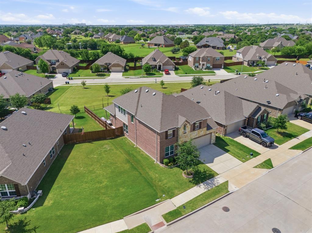 Welcome to this stunning 2019 Pulte built home offering 5 spacious bedrooms, 3 full bathrooms, and 3,199 square feet of beautifully designed living space in the highly sought after Northwest ISD! Combining functionality, comfort, and style, this home features an exceptional open concept layout perfect for both entertaining and everyday living.
From the moment you walk in, you’ll appreciate the spacious feel, abundant natural light, and thoughtful design throughout. The large living room is centered around a gorgeous stone fireplace that creates a warm and inviting focal point. The chef inspired kitchen overlooks the main living and dining spaces and features a large island, double ovens, extensive cabinetry, and ample counter space perfect for hosting gatherings or enjoying quiet nights at home.
One of the standout features of this home is the incredible storage and bedroom space. All five bedrooms include walk in closets, while the oversized primary suite offers not just one, but two walk in closets for maximum storage and convenience. The spacious primary retreat provides the perfect place to unwind after a long day. Upstairs, you’ll find a versatile game room flex space ideal for a media room, playroom, home office, workout area, or second living space. With multiple living areas and a highly functional layout, there is truly room for everyone.
Step outside to your backyard featuring a covered patio and additional extended patio space, creating the perfect setup for outdoor entertaining or relaxing evenings. Backing up to a peaceful greenbelt, this property offers added privacy with no neighbors directly behind you.
Conveniently located near shopping, dining, entertainment, and major highways, this move in ready home combines generous space, and an unbeatable location.