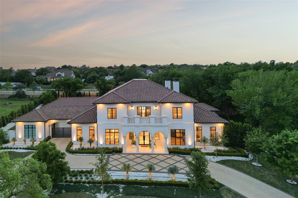 Prepare to be captivated by this Mediterranean-inspired masterpiece that seamlessly blends classic architecture w modern transitional elements, located in prestigious Quail Hollow. This 24 hour guard gated community is the most highly coveted neighborhood in Westlake. This luxurious 7,810 sq ft custom home boasts 5 bdrms, 5.2 baths, & a 5 car garage w porte-cochere. Step inside to discover a world of elegance, featuring pristine white marble flooring, European inspired cascading staircase, custom designer tile adorning walls & ceilings, & more! A temp-controlled wine wall w glass doors, book-matched marble feature wall w fireplace, & main floor media room are a glimpse of the exquisite details that await. The owner's suite is a sanctuary of comfort & style,offering expansive windows overlooking a private backyard oasis, & a safe-storm room. Outside, unwind in your own paradise w a sparkling pool & spa, expansive covered patio w fireplace, outdoor kitchen, & putting green. This home is a testament to luxury living at its finest, where every detail has been meticulously crafted to create an unparalleled living experience. Westlake Academy and open enrollment to CISD!
