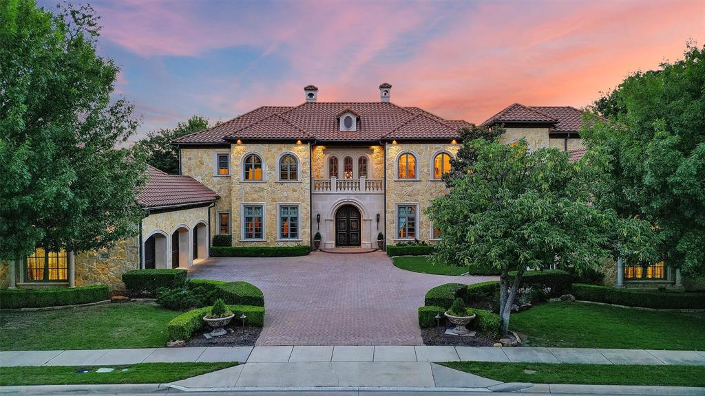 Indulge in the allure of Tuscan living within the heart of Frisco at this stunning home. This east facing home is elegantly designed with warm earth tones, rich textures, and timeless architectural elements, this residence offers a seamless blend of Old-World charm and modern comfort. Step through the grand entryway into a world of refined luxury, where artisanal finishes create an ambiance of sophistication and tranquility. The spacious living areas are adorned with custom details, from the inviting fireplace to the panoramic windows that frame picturesque views of the lush landscape and pool. The gourmet kitchen is a culinary masterpiece, featuring top-of-the-line appliances, and a large island perfect for entertaining. The master suite is a private sanctuary, boasting a spa-like bath. All bedrooms are en-suite and there is immense storage throughout the home.  Upstairs has large media and game room with balcony overlooking backyard.