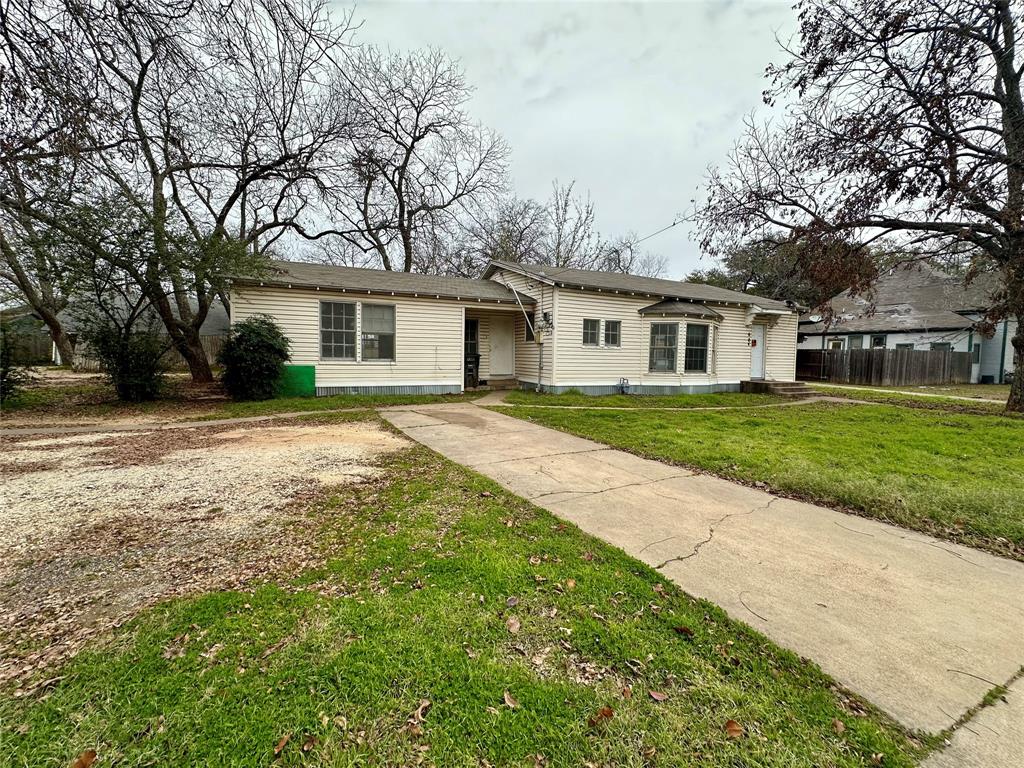 This property is being sold as is and comes with a ton of possibilities. Sitting on a large lot this 1930's home features original hardwood floors and newer roof. Home also offers a small guest house with a one car garage. Buyer and buyers agent to verify square footage.