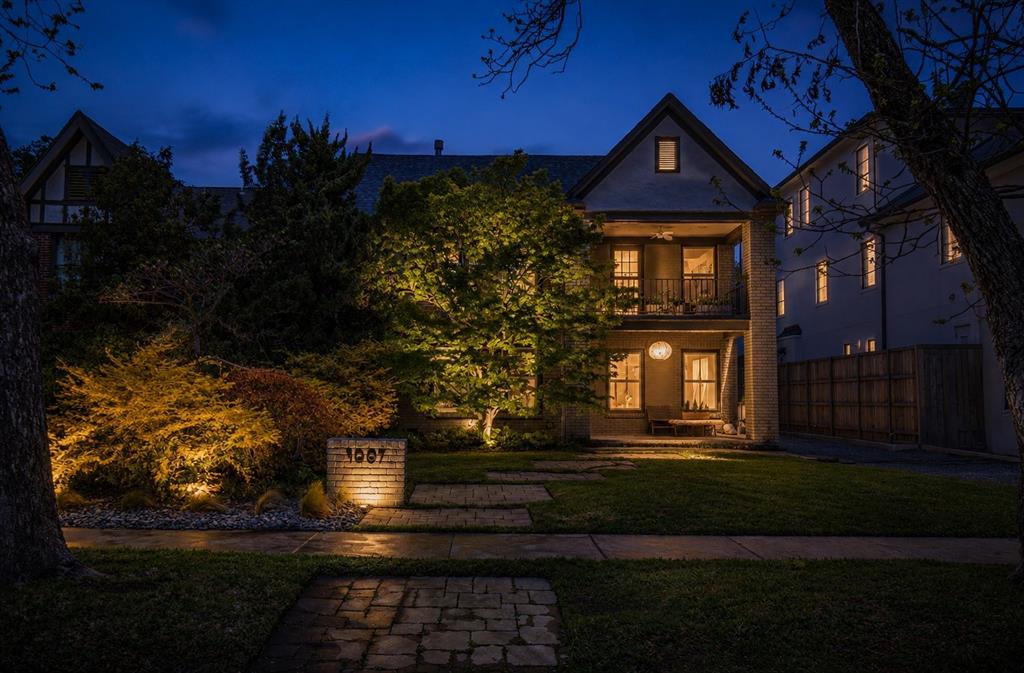 Experience a distinctive blend of architectural character and refined modern living in one of Oak Lawn’s most sought-after locations. Originally a duplex, this thoughtfully reimagined single-family residence offers a sophisticated layout designed for both entertaining & effortless daily living.
The main level is filled with natural light, framed by expansive Pella windows. At the heart of the home, the formal living room is anchored by a fossil limestone-clad gas fireplace, seamlessly flowing into the dining area and a well-appointed walk-in bar complete with ice maker—ideal for hosting. A generously sized first-floor bedroom offers flexibility as a guest suite or private study.
Toward the rear of the home, a secondary living area overlooks the professionally landscaped backyard and expansive deck, opening to a white marble kitchen with integrated bar-height seating. The layout is both functional and visually cohesive, designed for gathering and everyday comfort.
Upstairs, a third living area that could be a library, media room, or add a wall to make a 4th bedroom, extends to a covered balcony—perfect for relaxed evenings—alongside a spacious secondary bedroom and full bath. The primary suite is notably expansive, easily accommodating a sitting area in addition to bedroom furnishings, and is complemented by marble finishes in the primary bath.
The backyard is a private retreat-lush, expansive, and thoughtfully landscaped for those with an eye for design as well as function. Mature greenery, professional lighting, and curated plantings frame the generously scaled deck area for seamless indoor-outdoor entertaining, and room for a pool.
4009 Prescott is positioned just minutes from Dallas’ premier dining & shopping Downtown, Uptown, Turtle Creek, Highland Park, and University Park as well as convenient access to major highways, this residence delivers a polished, urban lifestyle in one of the city’s most desirable neighborhoods.