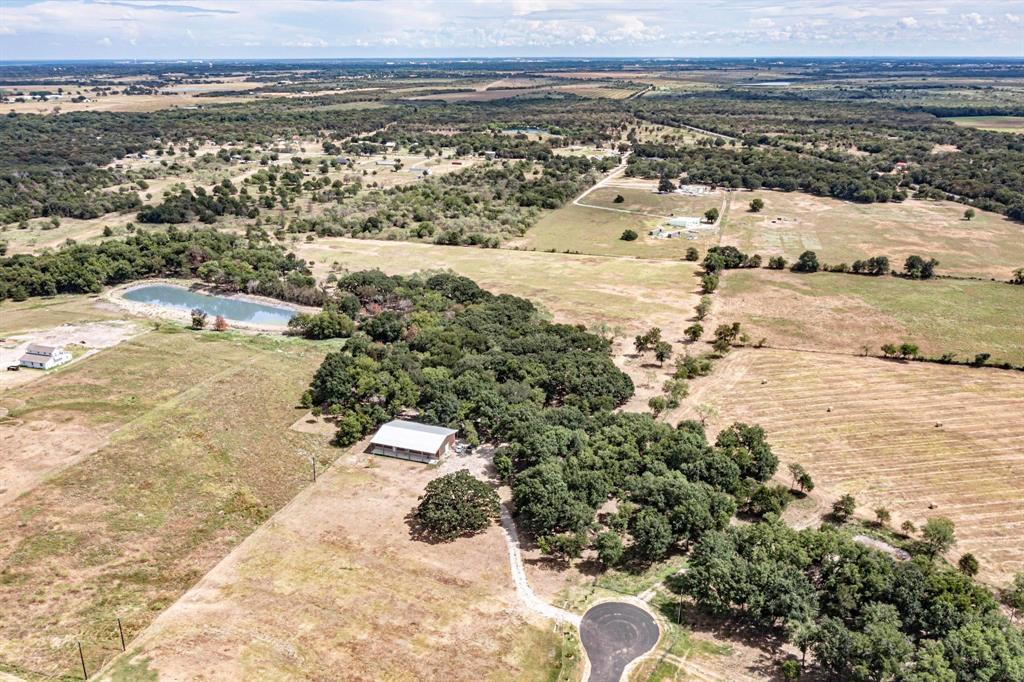 Welcome to a peaceful countryside retreat in of Corsicana, Texas. This expansive 22+ acre property offers an incredible opportunity to build the home of your dreams on a truly spacious piece of land. Fully fenced and surrounded by beautiful mature trees, the property provides privacy, tranquility, and plenty of room to create your ideal country lifestyle.

The land features a picturesque pond filled with fish, adding charm to the landscape and creating the perfect spot to relax and enjoy nature. With water and electricity already available on the property, it’s ready for your future home, ranch, or weekend getaway.

For those who enjoy animals, farming, or large projects, the property also includes a 40 x 80 warehouse, stables, and a chicken coop, offering endless possibilities for storage, hobbies, or a rural lifestyle.

Located in an area with new constructions nearby, this property combines peaceful country living with excellent potential for future growth. Don’t miss the opportunity to own this unique slice of Texas land and build the life you’ve been dreaming of.