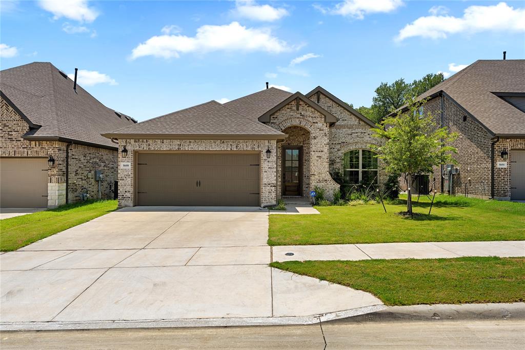 Located in the gated community of Meadowbrook Park, this 3-bedroom, 2-bath home offers modern living surrounded by mature trees. Built in 2023, the open-concept layout features a gourmet kitchen with an oversized island, built-in appliances, and a five-burner gas cooktop—perfect for everyday living and entertaining. Relax on the covered back porch while enjoying peaceful treetop views. Ideally positioned near the Fort Worth–Arlington border, the home provides convenient access to AT&T Stadium, Globe Life Field, Six Flags Over Texas, The Parks Mall at Arlington, and downtown Fort Worth.
