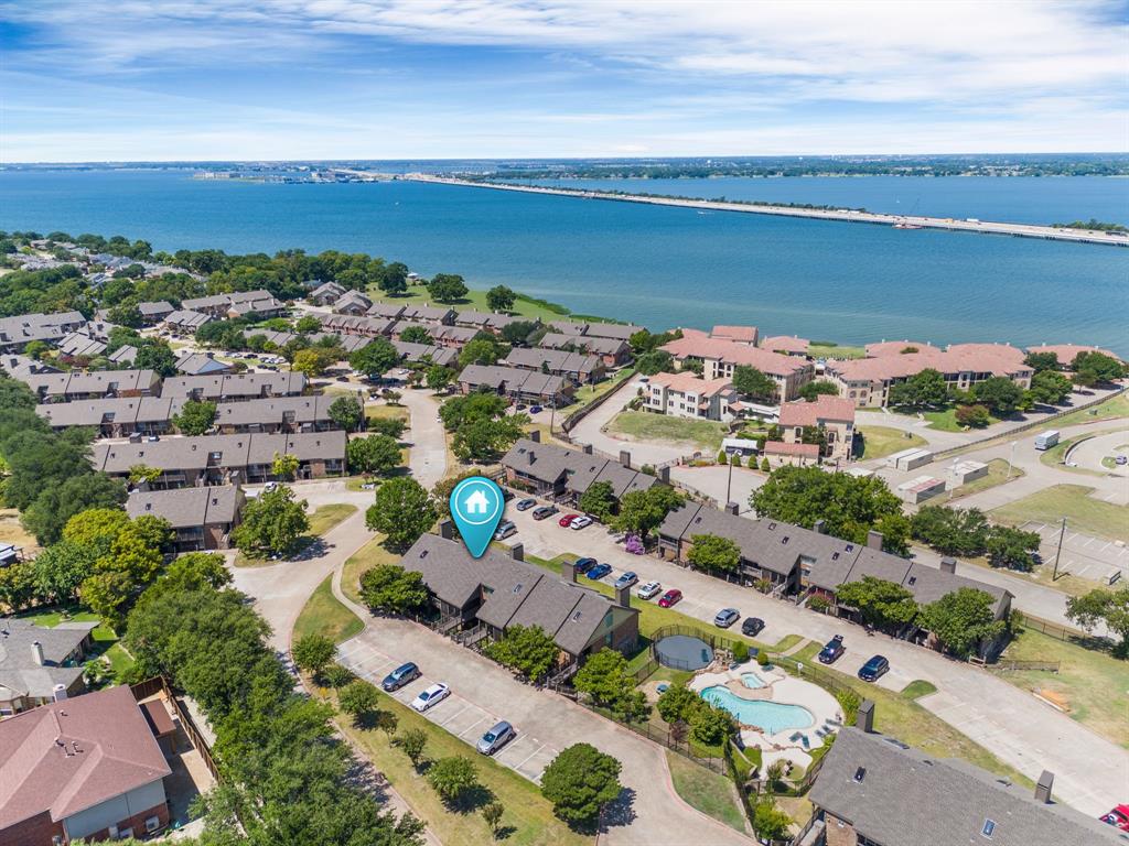 Rare LEVEL-ENTRY condo in Signal Ridge featuring a well-designed, versatile floor plan. Enjoy a large patio with partial lake views and spacious living areas. This home has been well maintained with thoughtful updates over time, offering comfort and convenience in a prime Rockwall location walking distance to The Harbor and Lake Ray Hubbard. Community amenities include two pools, with one located adjacent to the building. A large walk-in attic provides excellent storage space.