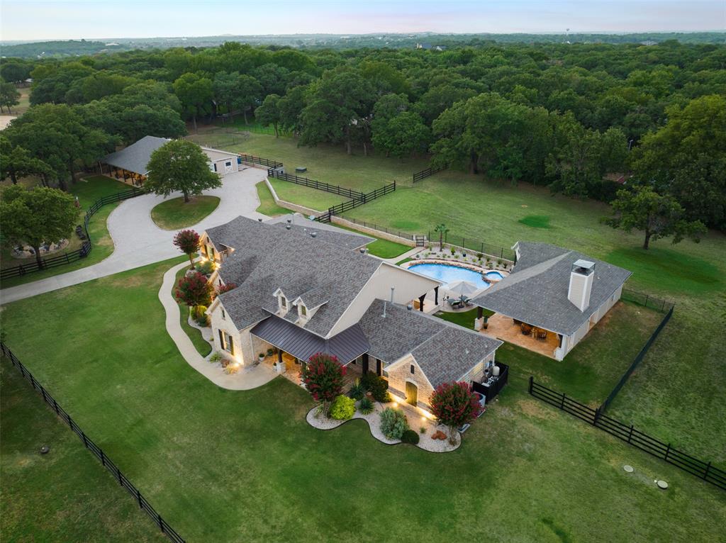 Welcome to this exquisite luxury ranch estate nestled on 5 acres of beautifully landscaped grounds. This one-story masterpiece boasts timeless elegance and offers the perfect combination of sophistication and comfort. As you enter the main residence, you'll be captivated by the attention to detail and open floor plan that creates an inviting atmosphere perfect for entertaining on any scale. Beyond the main residence, you'll find the newly built guest house providing a convenient and private space for visitors. The lush outdoor oasis is truly a paradise, complete with a sparkling pool, an expansive covered cabana with kitchen, pool bath and fireplace for lounging and entertaining. Located in a highly desirable neighborhood, this luxury estate offers unparalleled privacy while still being in close proximity to a variety of amenities. Don't miss your chance to own this exceptional property that combines luxury, comfort and natural beauty. Schedule your private viewing today!
