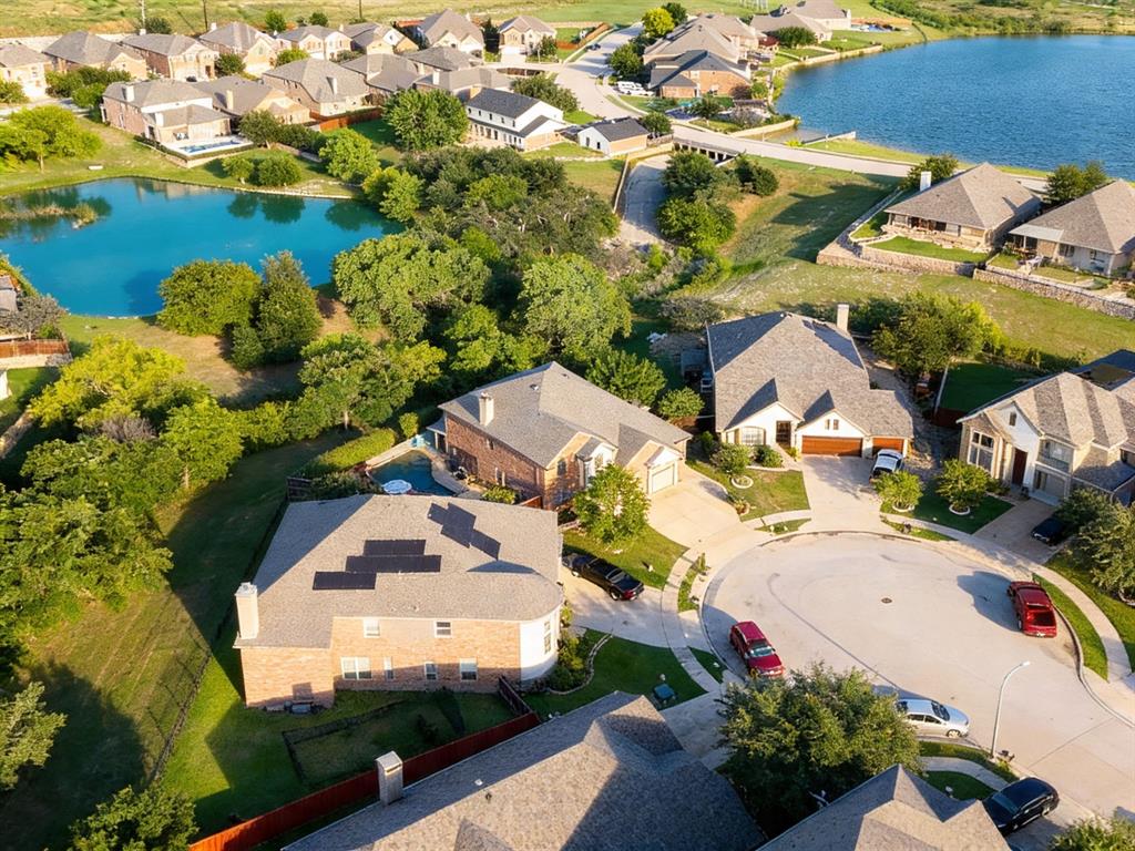UNBELIEVABLE RARE FIND in the Seventeen Lakes Community. WOW! The 3rd CAR GARAGE can ALSO be a 4th because you can DRIVE ALL THE WAY through the back to another private parking space OPENING! Exceptional Drees-built ENERGY STAR home nestled on a quiet cul-de-sac, won't disappoint offering private backyard oasis with waterfall feature on a serene private greenbelt, floral walkway to side yard with shed, gentle stream, and lake view from the second story. Spacious 5 bed, 4 bath combines luxury, comfort, & functionality with over the top storage & an incredible floor plan. Step through the custom decorative solid wrought iron front door which also opens to reveal a screened ventilation panel offering sophistication. Bright & natural light open-concept layout featuring a private study with french glass doors, dining room, and an expansive living room anchored by a stunning stone wood burning fireplace & showcasing the stone brick entry to the kitchen. Gourmet kitchen showcases granite countertops, abundant cabinetry, dual ovens, & a sunny breakfast nook. Private first floor primary retreat offers serene water and greenbelt views, a tray ceiling, window seat, walk-in shower, separate vanities, custom built closet, & a heavy solid WINCHESTER SAFE for all your special belongings. Upstairs features 4 oversized bedrms, 2 full baths, media & flex game rm with built in shelving. Head back downstairs & exit the other custom decorative solid wrought iron door to your OWN PIECE OF PRIVATE PARADISE. Morning & evening swims while also just unplugging from busy days will bring total relaxation especially while you sit & listen to the waterfall feature & take in the nature lover's dream with the sounds of birds chirping, butterflies fluttering, dragonfly visits, ducks & geese fly above to the lake, & the hummingbirds enjoying the sweet nectar from the flowers and feeders. Don't wait too long on this one. Time to start the grill & enjoying your vacation right from your very own home.