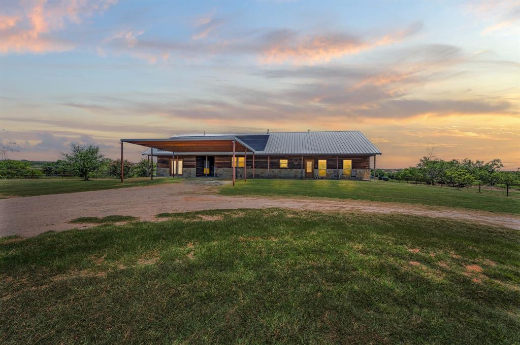 North Texas Horse Property situated on 49+ Acres, located 30 minutes NW of Fort Worth and only minutes from the small town of Boyd. This estate offers multiple homes, level to rolling terrain, cross-fenced pastures, lighted arena, 10-stall barn with runs, several out buildings, shop, pipe fencing, electric gated entrance and covered trailer parking. 

The main home offers 2,644 sq. ft. of air-conditioned living space, including 3 bedrooms and 2 bathrooms. Additionally, a fourth bedroom, ideal for mother-in-law quarters, is located across a breezeway for added privacy. The kitchen is equipped with an abundance of cabinets, stainless steel appliances, breakfast bar and granite countertops. The spacious living area, open to the kitchen, boasts a floor-to-ceiling stone fireplace, perfect for cold winter evenings and don’t forget about the long covered patio that provides a relaxing spot for morning coffee before tending to livestock. The guest house, is a charming farmhouse situated towards the front of the property. It includes 2 bedrooms, 2 bathrooms, office, wood floors, a metal roof and a fenced yard. The third residence is a well-maintained 3-bedroom, 2-bathroom mobile home, suitable for guests, ranch help, or as a rental income opportunity. Country living with city conveniences nearby. Welcome home to your family compound and country estate. Call for a private tour today!

*Buyer unable to sell other home & secure financing*