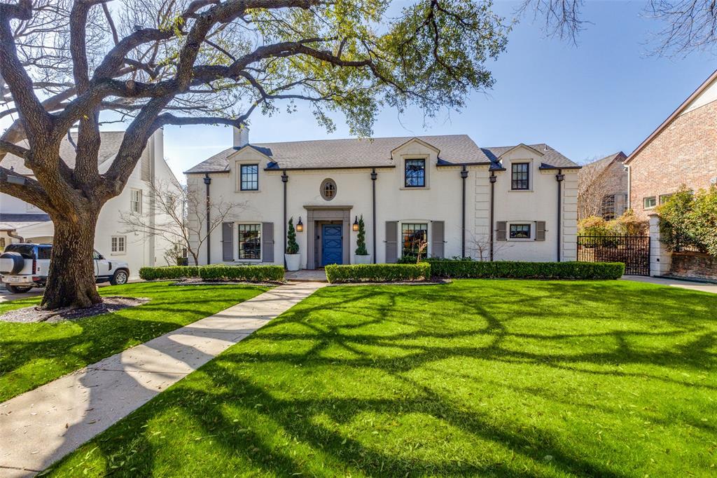 In the heart of Lakewood, this timeless 1930 Colonial seamlessly blends classic architecture with thoughtful modern updates, creating a warm yet sophisticated retreat. Extensively renovated in 2014, the home offers four bedrooms, three and a half baths, a private study, and a rare one-bedroom guest house—each space designed with comfort and versatility in mind.
Inside, gleaming hardwood floors and gracious formal rooms set the stage for both elegant entertaining and everyday living. The inviting living room, anchored by a stunning fireplace, opens to an oversized covered patio overlooking the beautifully landscaped backyard—perfect for morning coffee or evening gatherings
The chef’s kitchen is a true centerpiece, featuring a large island, dual sinks, a six-burner range with double ovens, and a charming banquette for casual dining. A butler’s pantry with dual under-counter wine and beverage refrigerators adds convenience, while the adjacent study with custom built-ins provides flexible space for work or relaxation.
Upstairs, the serene primary suite offers a private escape, complete with a walk-in closet and spa-inspired bath showcasing marble countertops, a soaking tub, and an oversized shower. The secondary bedrooms are generously sized, with one offering an en-suite bath and two sharing a well-appointed hall bath.
The finished basement—expertly re-engineered to remain completely dry—provides additional living space, including a bonus desk or wrapping area ideal for hobbies or a quiet retreat.
Outdoors, the manicured grounds lead to an updated oversized garage with washer-dryer hookups and a charming second-story guest house. The guest suite features a spacious living area, kitchenette, private bedroom, and a delightful balcony that captures the afternoon light.
With its graceful curb appeal, preserved 1930s charm, and modern amenities, this Lakewood residence offers a rare opportunity to enjoy timeless style paired with everyday livability.