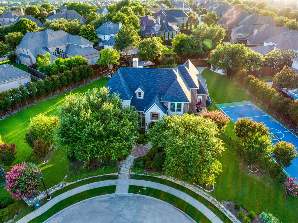 Showstopper! Entertain Friends and Family in this Rare Gem and Private Oasis in Prestigious Lexington! This Former Custom Model Home is Located at the end of a Quiet Cul-De-Sac on nearly Three-Quarter Acre Lot in Collin County's Highly Desirable Location and Master Planned Community of Twin Creeks. Welcome Home to Soaring Ceilings, Sweeping Staircase and High-End Amenities that were thoughtfully chosen with attention to detail from the moment you arrive! Great Room showcases Beautiful Stone Fireplace and Custom Skylights that open into Chef's Dream Kitchen that checks all the boxes! Viking Professional Cooking Appliances, Built-in Viking Fridge, Double Ovens, Island Seating, Butler's Pantry and much more! Retreat to one of the 5 Spacious Bedrooms all with Ensuites, Walk in Closets and Solid Core Doors. Primary Bedroom and Additional Guest or In-Law Suite are located on the First Level. Secondary Staircase leads up to Spacious Game Room with Wine Cellar, Wet Bar and Home Theater! Binge Watch all your Favorites from your Stadium Seats in the Media Room with Oversized Screen and State of the Art Audiovisual Components including Hard-wired Speakers throughout the Property. Want to get Away and Escape to Paradise? Cozy up to the Wood Burning Fireplace on the Covered Back Porch before retreating to Family Dinner under the Arbor and Stars. Property is Surrounded by over 60 Native Trees, Professional Landscaping, Lighting and Lush Grass for Outdoor Play on the Playset or Soccer on the South Lawn. Ready Set Match! Enjoy Tennis, Basketball and Pickleball from your PRIVATE Regulation Tennis Sports Court on the North Lawn before cooling off in the Resort Style Pool and Spa! This Luxury Property is steps away from the Twin Creeks Arnold Palmer Designed Golf Course, Driving Range and Restaurant. Enjoy nearby High-End Shopping, Restaurants, Biking, Playgrounds, Parks, Community Pools, Tennis and Pickleball Courts! Allen ISD Schools and DFW International Airport under 30 min Drive