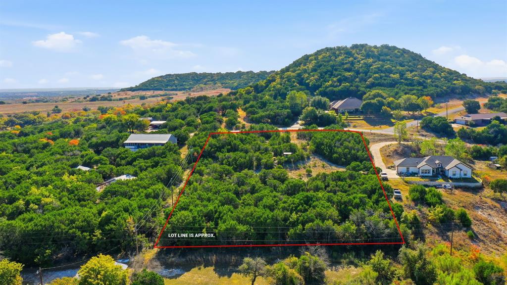 Scenic 2-Acre Lot on the Northwest Side of Comanche Peak – Just South of Granbury
Discover the perfect blend of privacy, views, and natural Texas beauty on this 2-acre lot situated on the northwest side of Comanche Peak, just minutes south of Granbury. This property offers a rare opportunity to build your dream home in one of the area’s most iconic and scenic landscapes.
The gentle terrain provides multiple potential building sites, each offering its own perspective of the surrounding hill country. With native trees, open spaces, and the rugged character of Comanche Peak towering nearby, the land feels peaceful, secluded, and uniquely Texan.
Whether you’re looking to create a full-time residence, a weekend retreat, or a long-term investment, this property delivers the freedom and space to bring your vision to life. Enjoy the quiet of the countryside while still being a short drive from Granbury’s historic square, Lake Granbury access points, and local dining and amenities.
A beautiful piece of land in a highly sought-after area—ready for whatever you imagine next.