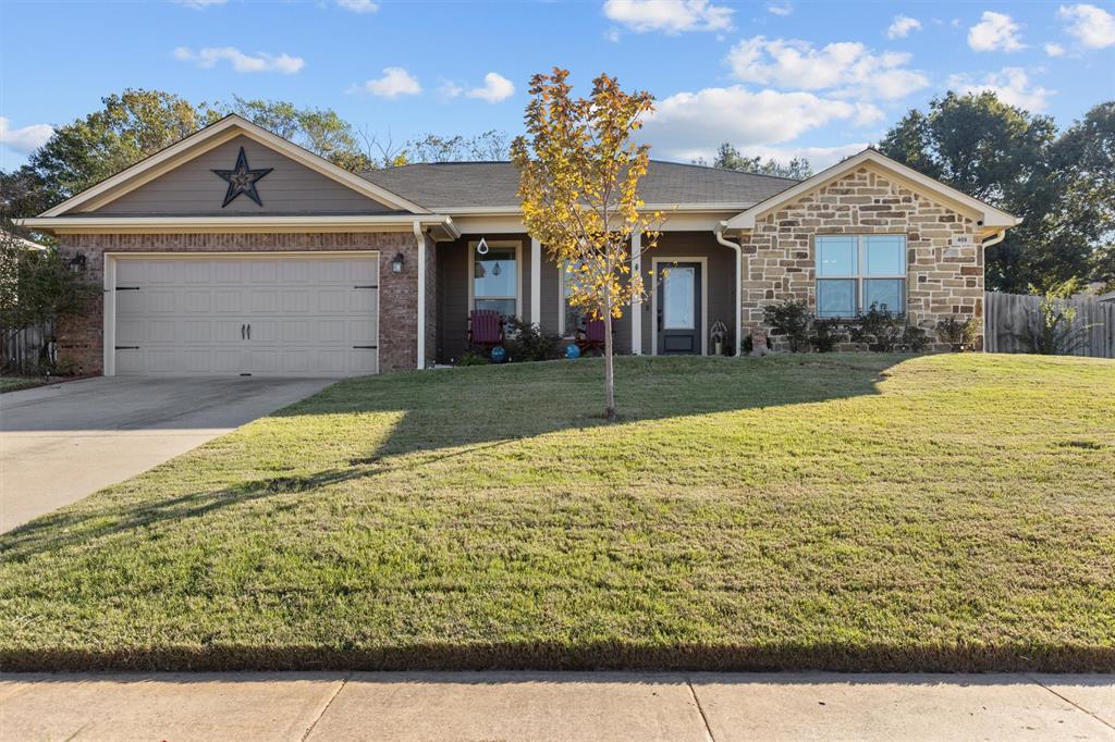 Don't miss out on this gem in one of Lindale's friendliest neighborhoods with tons of kids, practically zero traffic, a Mission Crest Facebook page, neighborhood block parties and mobile Santa during the holidays! This 3-2 home offers an open floor plan and smart home features, which include a Nest thermostat, Ring doorbell, Blink security cameras & apps to control the kitchen appliances, garage door, exterior lights & kitchen bar lights. You'll be greeted inside by beautiful tile flooring in the main living areas and an eat-in kitchen with custom cabinets, granite counters & new appliances - one being an air fry convection oven! The bedrooms offer ample space with walk-in closets and a double vanity in the primary bedroom. All bedroom TVs and mounts convey. Enjoy covered front and back patios, a new 11x14 storage shed, and a spacious backyard with peach and pomegranate trees. Perfectly located in the heart of Lindale and a short drive to Tyler. Schedule a showing today!