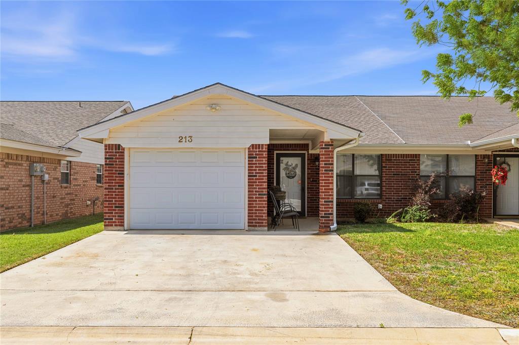 Low-maintenance living in the desirable Ridgewood Gardens 55+ community in Early, Texas! This charming duplex at 213 Wills Way offers comfort, convenience, and thoughtful updates throughout. Step inside to find a beautifully refreshed interior featuring vaulted ceilings, granite countertops, durable vinyl plank flooring, and a functional layout designed for easy living. A beautiful kitchen is the heart of the home with peninsula barstool dining and plenty of room to entertain. In addition to the main living area, a versatile bonus room provides the perfect space for a hobby room, home office, or second living area—tailored to fit your lifestyle. Enjoy peace of mind with a roof replaced in 2024, along with the added benefit of an attached one-car garage for convenience and storage. Living in Ridgewood Gardens means truly carefree homeownership—HOA services include yard maintenance, sprinkler system care, water, sewer, trash, and pest control, allowing you to spend more time enjoying what matters most. Whether you’re downsizing or seeking a relaxed, community-focused lifestyle, this move-in ready home is a fantastic opportunity in a sought-after 55+ neighborhood. Call today to schedule a private showing!