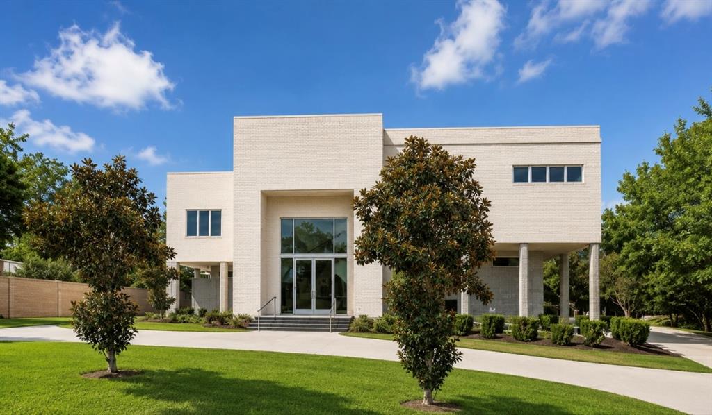 Experience luxury living in this stunning contemporary home, custom-built in 2009 on a generous 0.68-acre lot. Abundant natural light floods the spacious interiors, highlighted by soaring high ceilings and wall-to-wall windows in the living area. The abundance of windows in the living area enhances the feeling of being immersed in nature, offering picturesque views of trees that surround the property.
The heart of the home is a custom-designed kitchen, featuring elegant quartz countertops, double ovens, and a striking backsplash, perfect for both everyday meals and entertaining guests.
Retreat to the oversized master suite, a true sanctuary complete with a dual vanity bath, a relaxing soaking tub, a separate shower, and his and hers walk-in closets that offer ample storage.
Step outside to discover a sprawling backyard oasis, highlighted by a sparkling pool and ample space for outdoor gatherings and relaxation. The property also boasts an oversized garage equipped with two full-size doors, accommodating up to eight vehicles, providing convenience and additional storage options.
Ideally located, this exceptional property is just minutes from some of Dallas's most prestigious private schools, offering convenient access to premier educational opportunities while maintaining the privacy and tranquility of its lush, wooded setting.