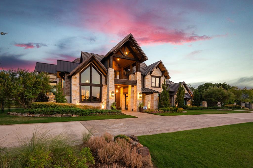 Prominent 2 acre estate nestled in the gated & guarded neighborhood of Chateau de lac. A picturesque entryway brings you into this luxurious & light filled home. The spacious kitchen is chef inspired with professional grade appliances, custom cabinetry and 2 massive islands perfect for gathering people together. A mezzanine level home office is perfect for working while the media room & game room are ideal for play! The Primary Suite is a peaceful retreat with a fireplace, sitting area, spacious closets and a spa-like bathroom. Impressive outdoor living features a gorgeous fireplace, spiral staircase leading to a tranquil balcony, outdoor kitchen and sprawling yard. Future elevator - prewired and framed. Ideal location in Flower Mound. Flower Mound has been named one of the most livable small cities for the 5th year in a row!